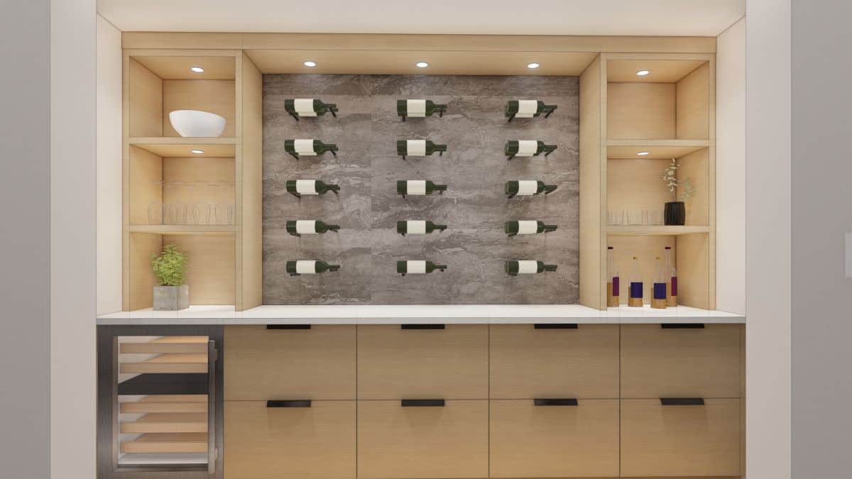 Wine bottles arranged on a built-in wall with oak cabinetry and lighting.