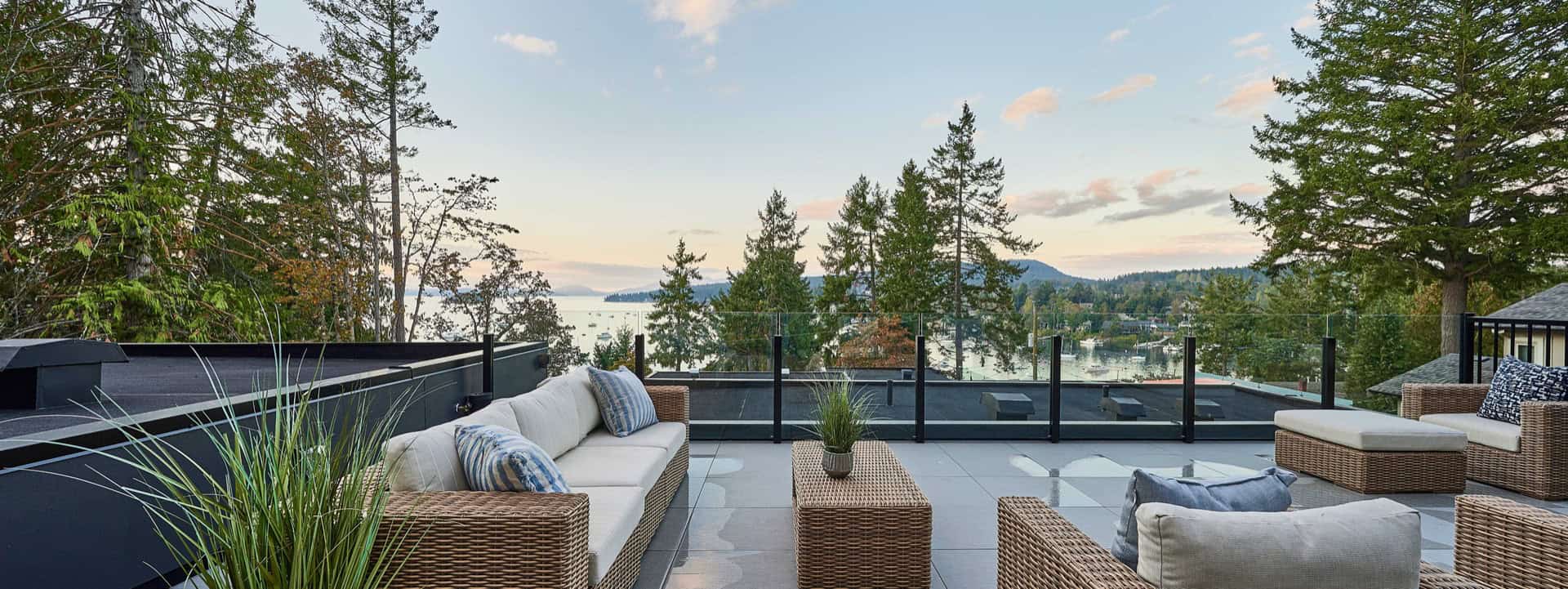 Outdoor living space with modern seating and lake view in Victoria BC.