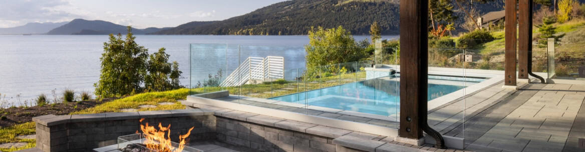 Spectacular poolside terrace with panoramic water and mountain views.
