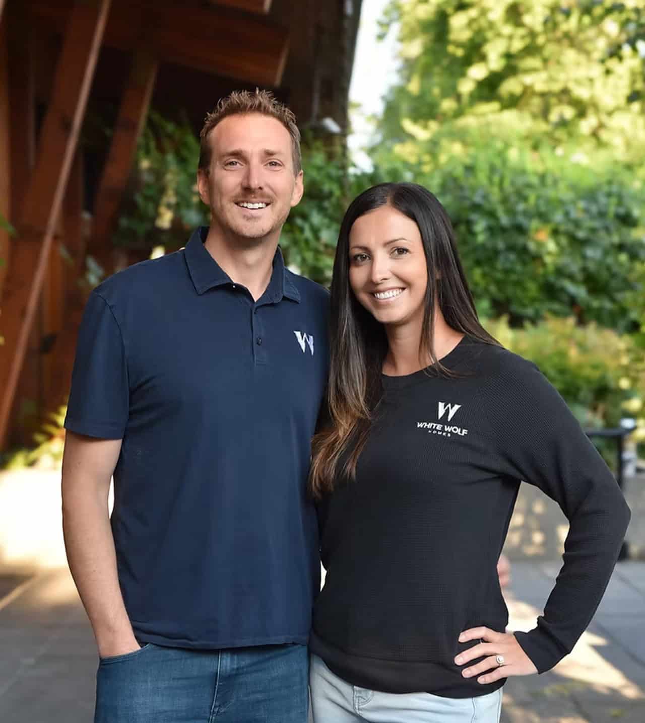 White Wolf Homes founders in dark polo and sweater outdoors in Victoria BC.