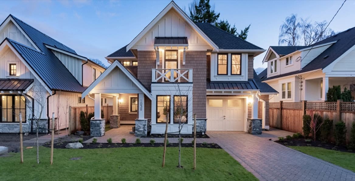 White Wolf Homes custom home in Victoria BC with modern design and landscaped yard.
