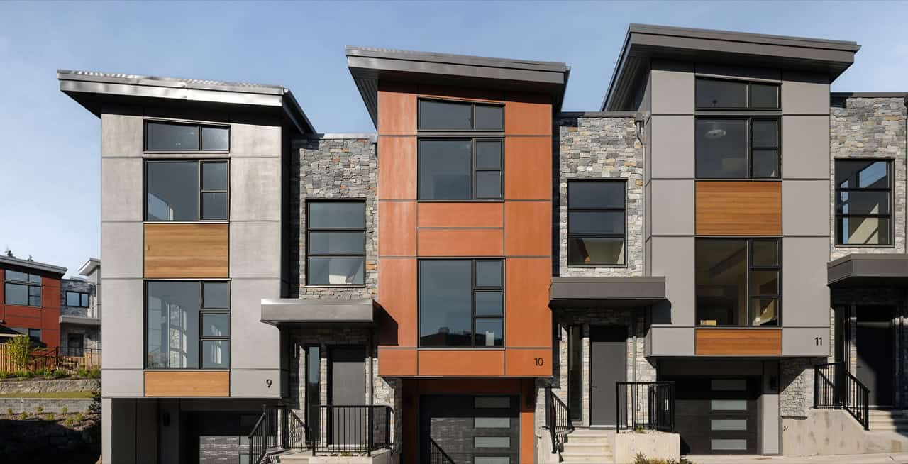 White Wolf Homes modern Victoria BC townhomes with stone and wood accents.