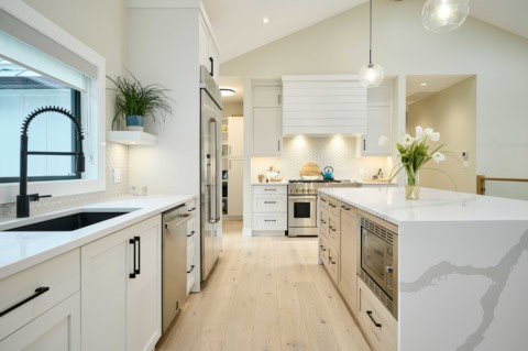 White Wolf Homes kitchen in Rockwater project, modern Victoria home with island, white cabinets, and.