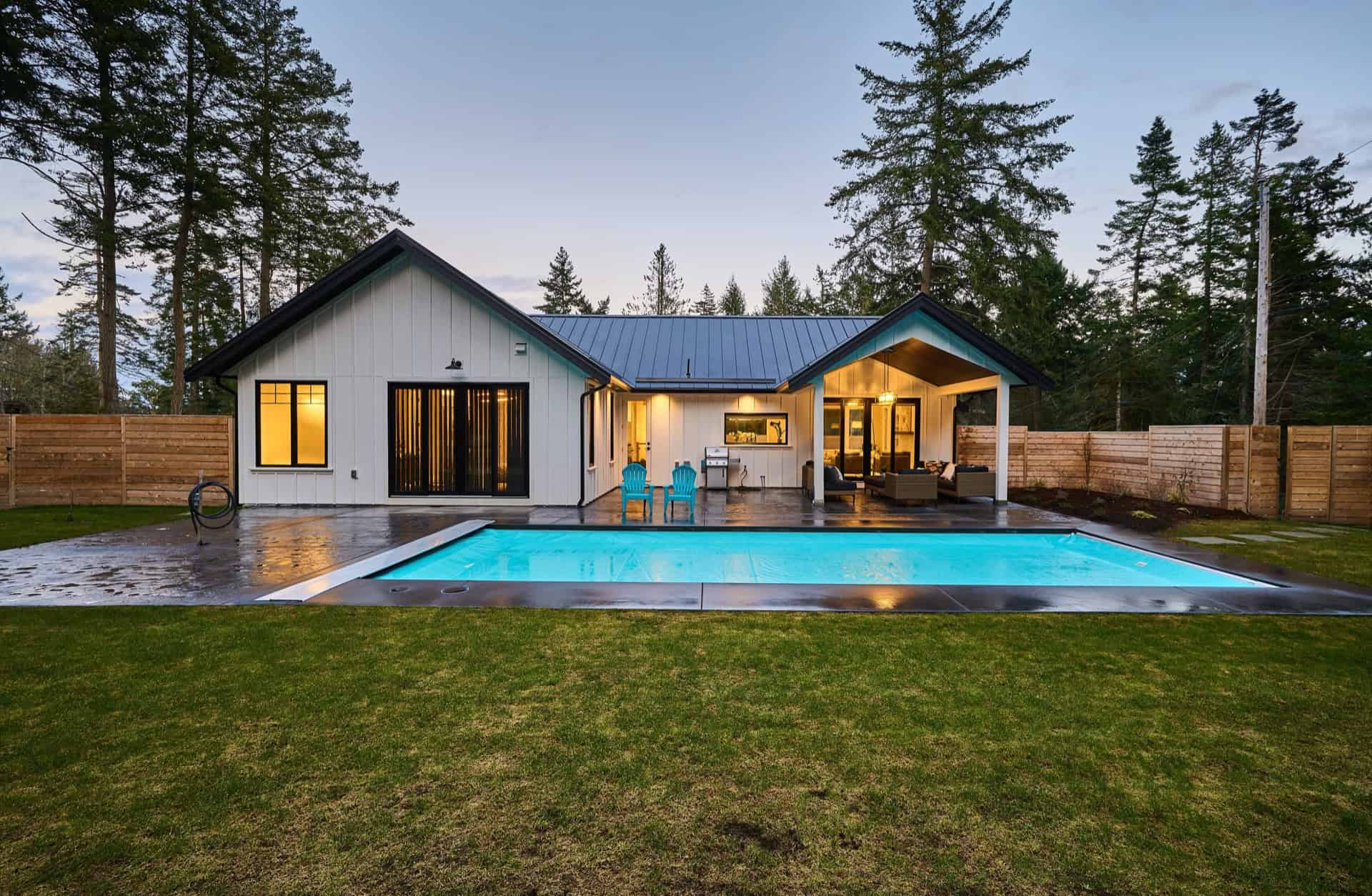 White Wolf Homes: modern Victoria BC custom home with pool and serene backyard.