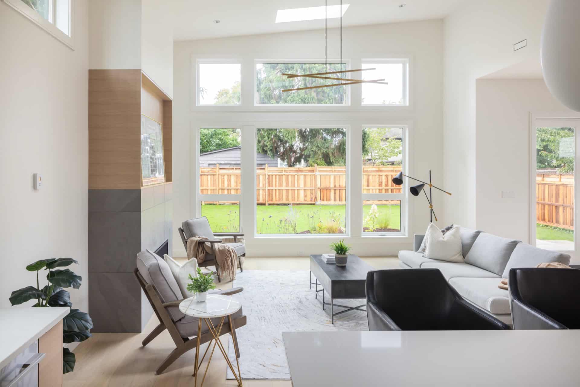 Bright modern living room with large windows and contemporary seating in Victoria BC.
