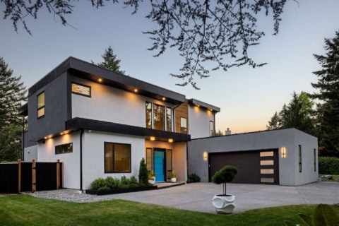 Modern two-story custom home with stucco and dark trim, Victoria BC.