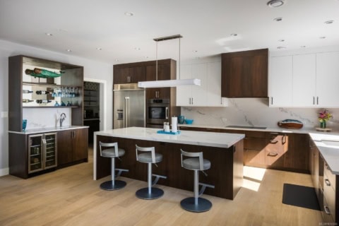 Modern Victoria BC kitchen with dark wood cabinetry and island.