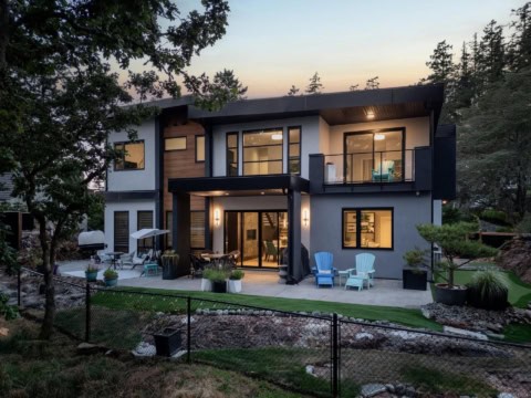 Modern two-story home exterior with patio and landscaped yard in Victoria BC.