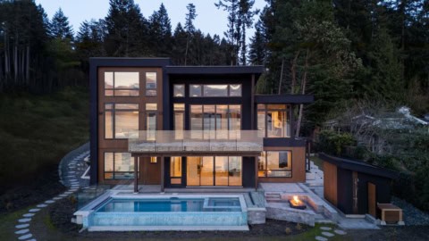 Modern custom home by White Wolf Homes with pool, timber accents in Victoria BC.