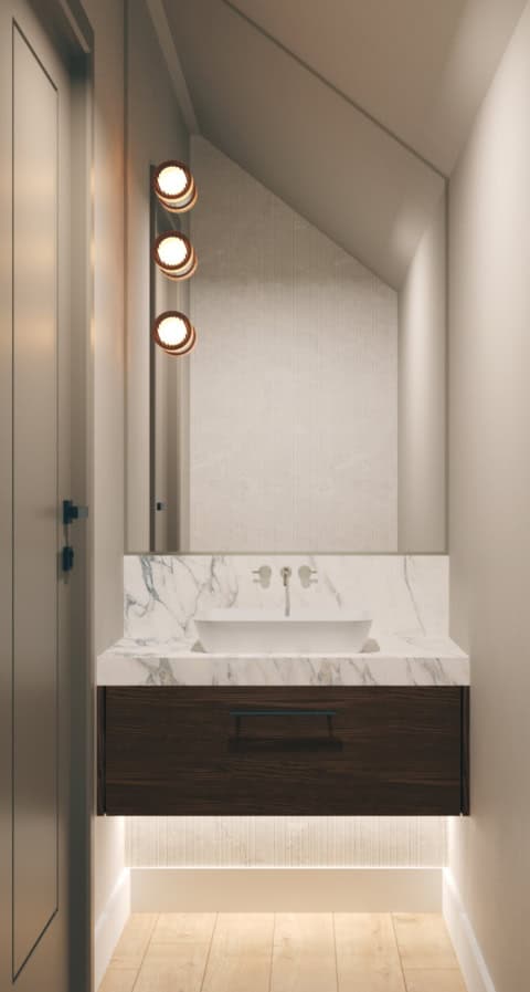 Modern bathroom vanity with marble countertop and warm lighting.