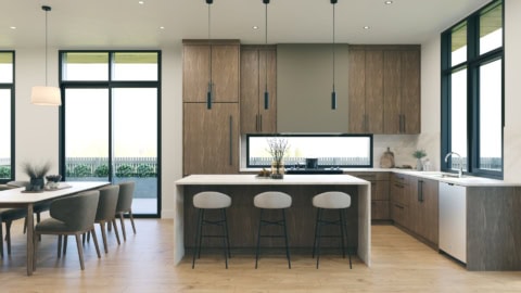 Modern kitchen with wooden cabinetry, island, and dining area in bright open space.